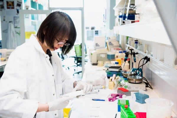 image of scientist working on a vaccine